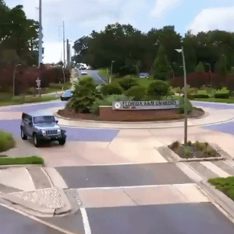 Famu Sign Featuring Car Passing By GIF