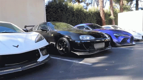 Fast Cars Parked Together GIF