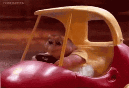 Baby Sinclair Driving A Fast Toy Car GIF