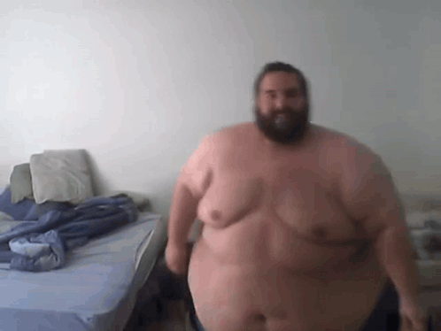 Fat Bearded Man Beside Bed