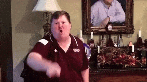 Fat Man Dancing in Living Room with Portrait