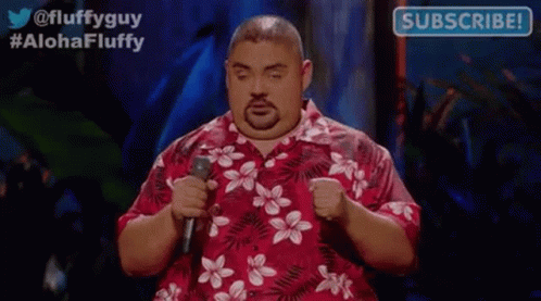 Fat Man in Hawaiian Shirt Holding Microphone Giving Speech