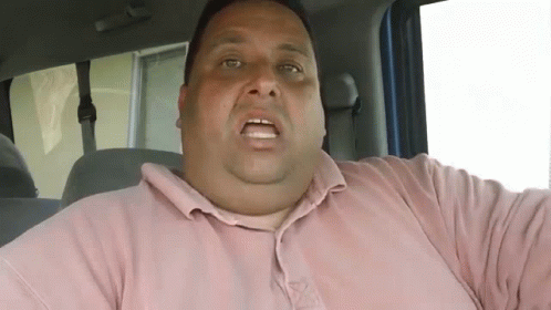 Fat Man In Pink Shirt Sitting In Car GIF