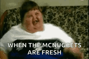 Fat Man Lying on Couch With When The McNuggets Are Fresh