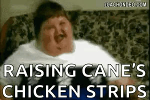 Fat Man on Couch with Raising Cane's Chicken Strips