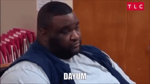 Fat Man Sitting In Front Of Wooden Door Saying Dayum GIF