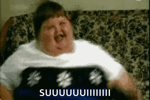 Fat Man Sitting on Couch with Suuuiiii