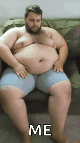 Fat Man With Beard Hands on Belly Saying Me