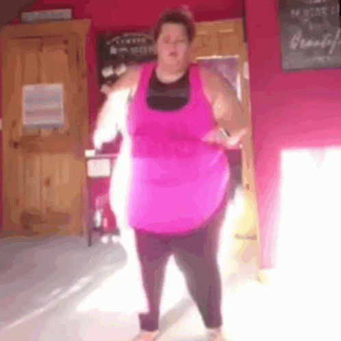 Fat Woman In Pink Tank Top And Black Pants Dancing GIF