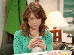 Feeling Giddy Upon Looking The Phone GIF