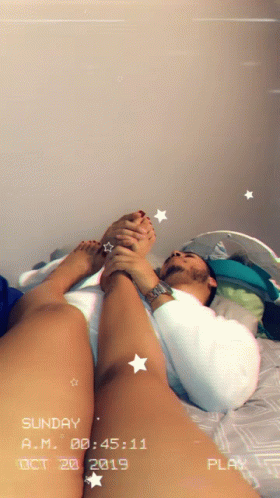 Cuddling And Massaging Feet GIF