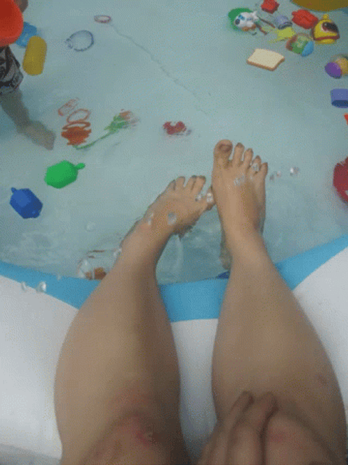 Feet In An Inflatable Pool GIF