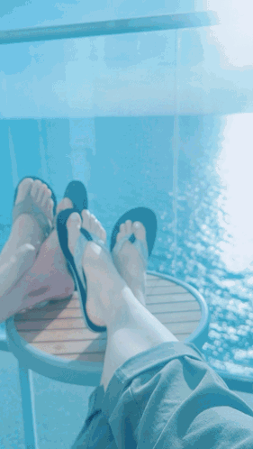 Feet Rest on Table Over Ocean