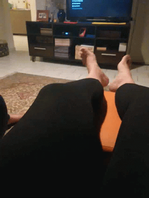 Feet Wiggling Watching TV GIF