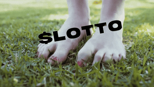 Feet With Lotto on Grass