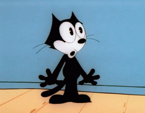 Felix The Cat Standing On A Wooden Floor GIF