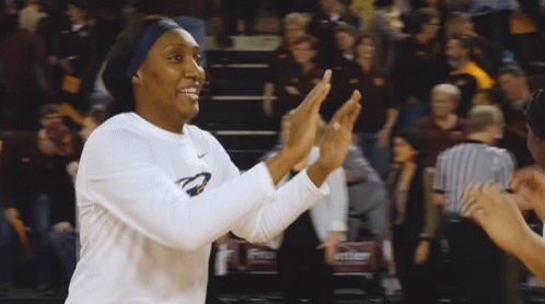 Female Basketball Player Applauds in Nike Shirt