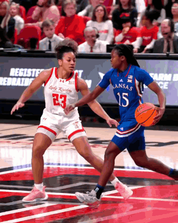 Female Basketball Player In Kansas Jersey Dribbling GIF
