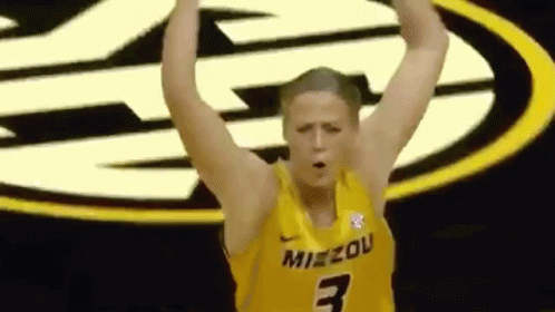 Female Basketball Player in Yellow Jersey Number 3 Raising Arms