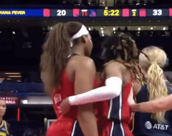 Female Basketball Players Hugging Mana Fever