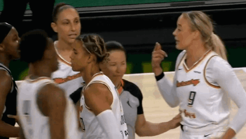 Female Basketball Players Talking On Court GIF