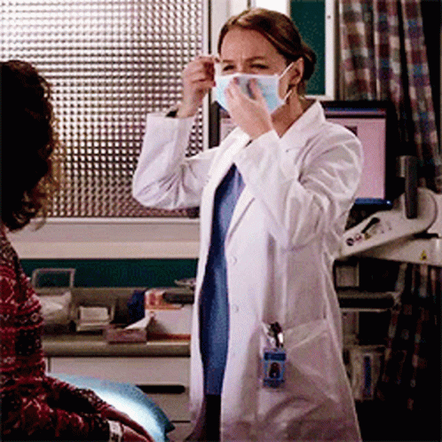 Female Doctor Wearing Mask and Name Tag