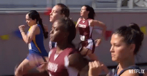 Female Runners Running on Track