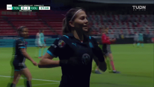 Female Soccer Player Celebrates Goal