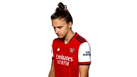 Female Soccer Player in Red Emirates Jersey