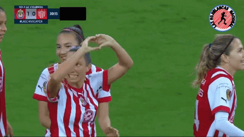 Female Soccer Players Celebrating Goal
