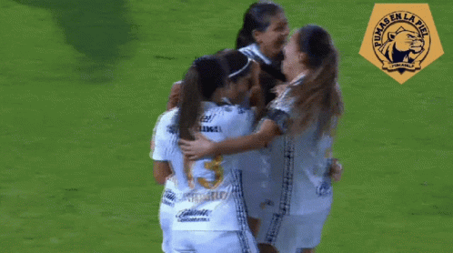 Female Soccer Players Hugging Number 15
