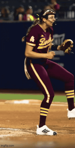 Female Softball Player in Maroon and Gold Duke Uniform