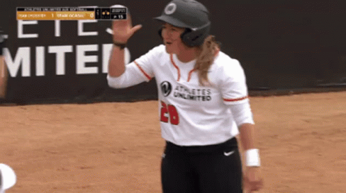Female Softball Player in White Shirt Number 20