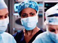 Female Surgeon Wearing Mask and Cap
