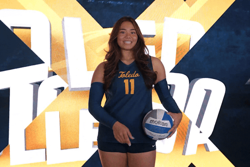 Female Volleyball Player From Toledo Holds Molten Volleyball
