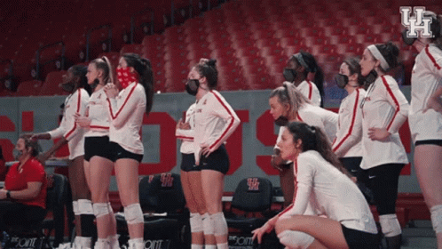 Female Volleyball Players in Face Masks With Letter H