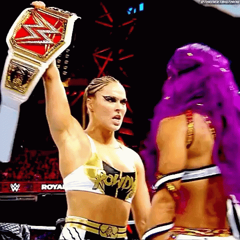 Female Wrestler Holding Belt