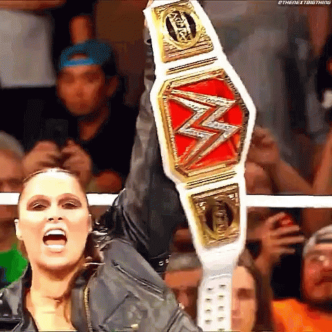 Female Wrestler Holding Championship Belt