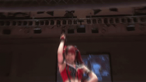 Female Wrestler in Black Shirt Saying Ping Dong Hello