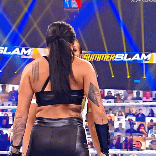 Female Wrestler in Front of Summerslam Sign