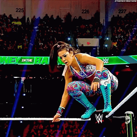 Female Wrestler Jumping Over Rope