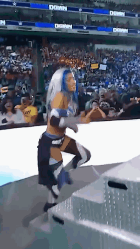 Female Wrestler Running On Stage With Crowd And Dawn Banner GIF