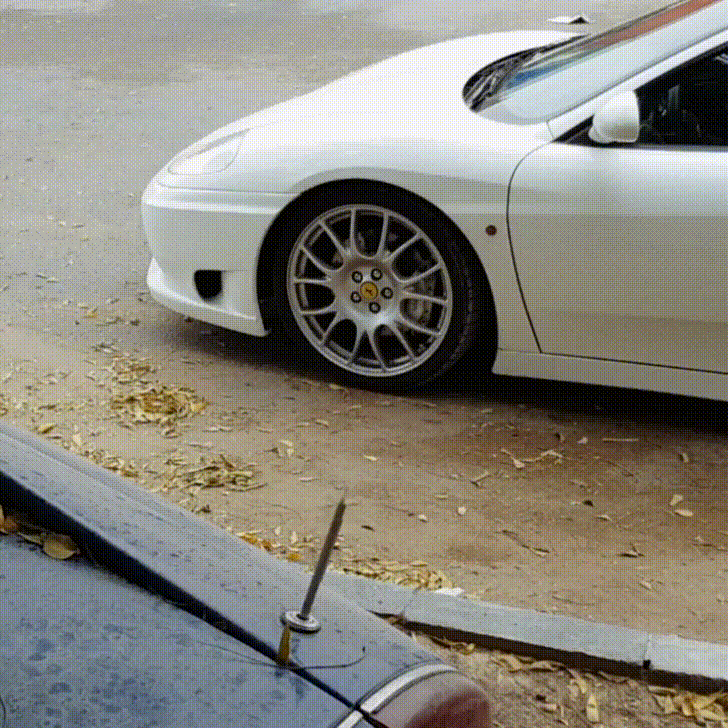 Ferrari White Car Park Breezy GIF