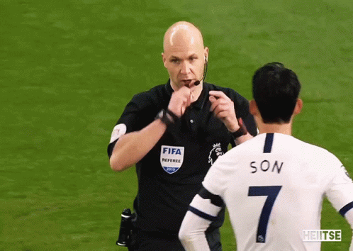 FIFA Referee Talking To Soccer Player Number 7 GIF