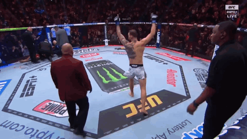 Fighter In UFC Ring With Monster Energy Drink GIF