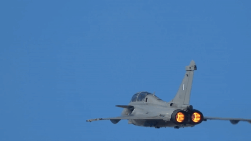 Fighter Jet With Number 1 On Tail Flying Through Blue Sky GIF