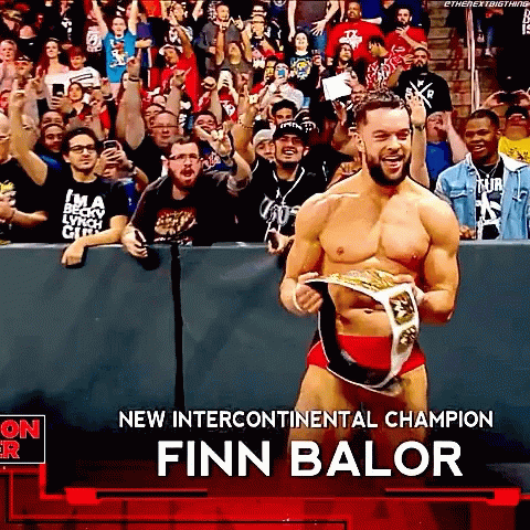 Finn Balor Is The New Intercontinental Champion And Is Holding His Belt In Front Of A Crowd . GIF