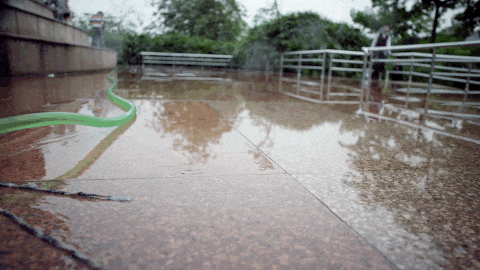 Fire Hose Splash Water On Camera GIF