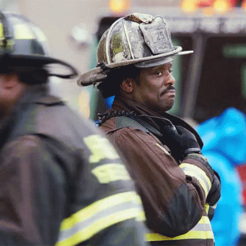 Firefighter Wearing Helmet With Number 25