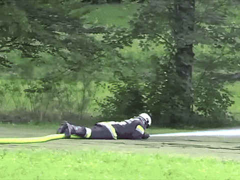 Fireman Demonstrate Fire Hose Power GIF